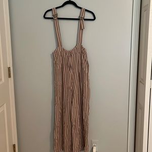 Pink and white forever 21 overalls. Adjustable straps. Loose fitting material.
